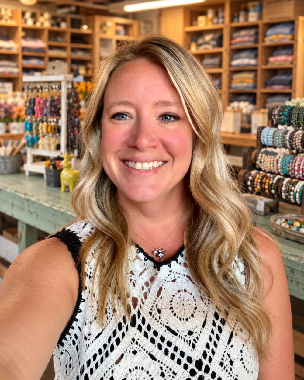 Lauren Steinmetz smiling in her farm merchandise workspace
