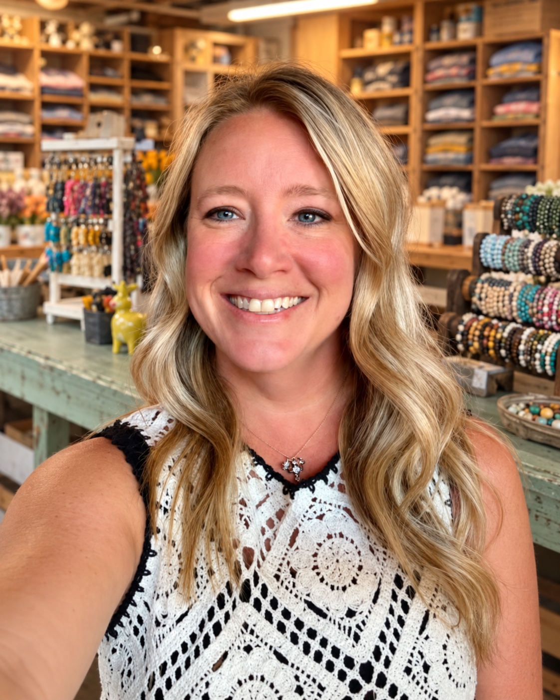 Lauren Steinmetz smiling in her farm merchandise workspace