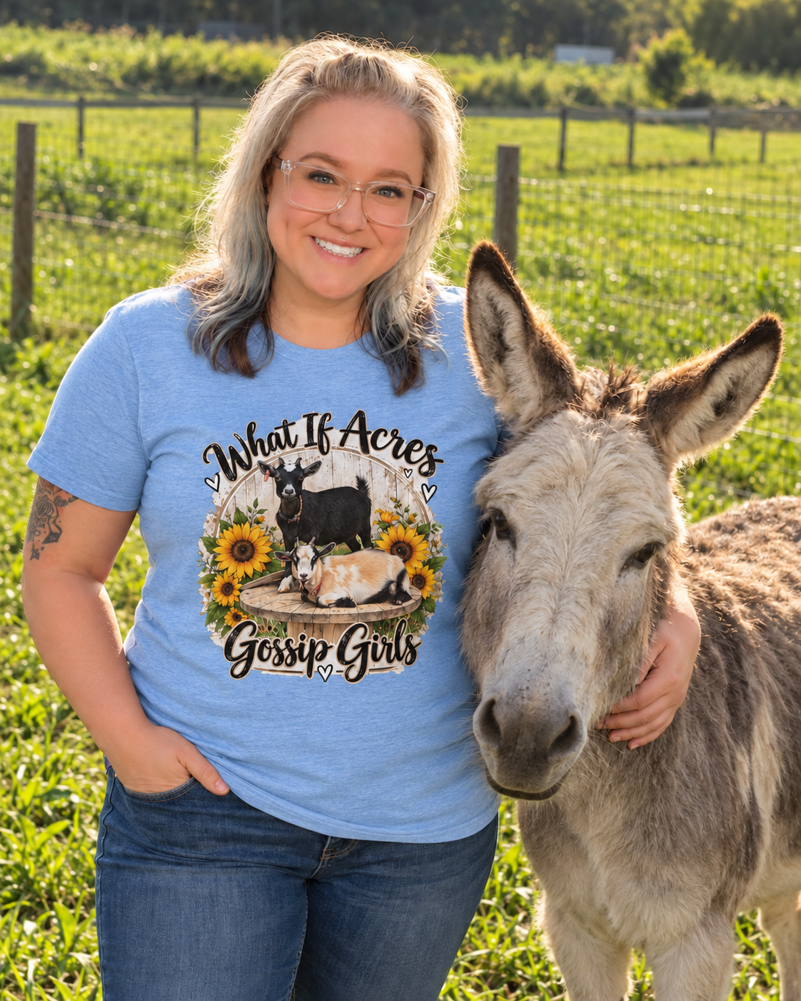 What If Acres Gossip Girls Light Blue short-sleeve shirt beside the donkey on the farm.